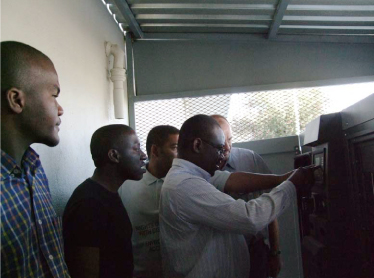 Joseph, Head of IT at MOHSS, retrieving the generator's vital indicators